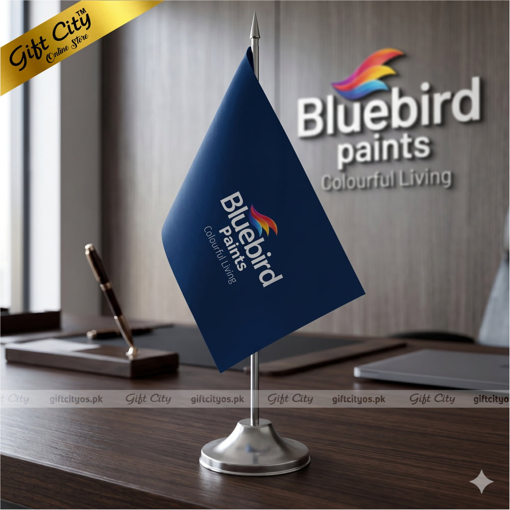 Bluebird Paints table flag on a desk with office background