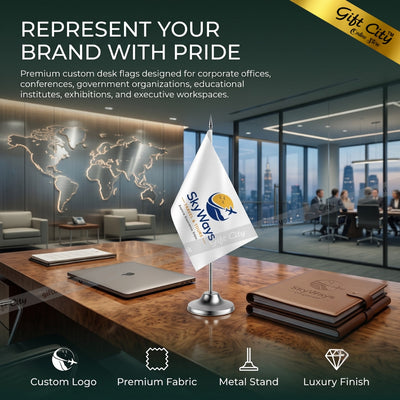 A small custom desk flag on a silver metal stand displayed in a modern office lobby. The flag is white with a blue and yellow logo that reads 'SkyWays'.