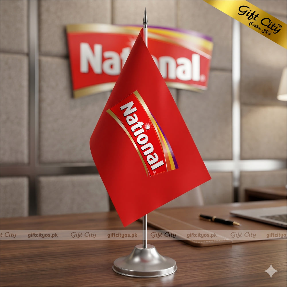 Red National flag on a stand with a blurred background